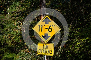 Yellow road sign, Low Clearance of 11â€™ 6â€, caution to tall vehicles