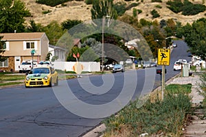 Yellow road sign saying "Slow children at play"