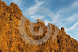 Yellow rock at blue sky in Thingvellir national park in Iceland