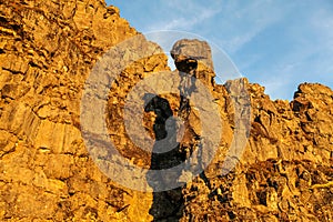 Yellow rock at blue sky in Thingvellir national park in Iceland