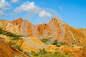 Yellow rock castle shaped mountains and rock formation valley