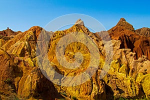 Yellow rock castle shaped mountains and rock formation valley