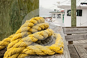 Yellow Rope Wrapped Around Post on Pier