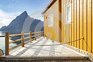 Yellow rorbu in small island Sakrisoy in Lofoten islands, Norway