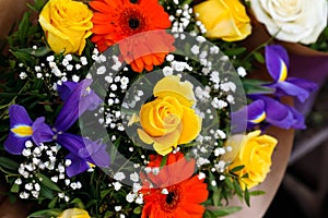 Yellow roses and other flowers create a bouquet