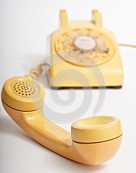 Yellow rotary telephone