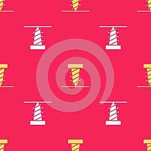 Yellow Rotating drill digging a hole in a ground icon isolated seamless pattern on red background. Vector Illustration