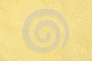 Yellow rough plaster background