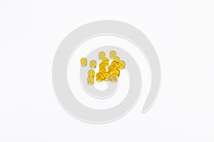 Yellow round capsules on a white background