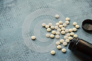 Yellow round tablets or pills vitamins