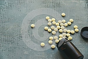 yellow round tablets or pills vitamins