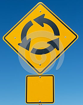 Yellow round about traffic sign