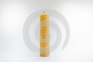 Yellow round wax candles with a honeycomb pattern