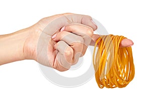Yellow rubber bands close up with hand isolated on white background.