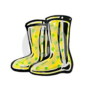 Yellow rubber boots in green peas