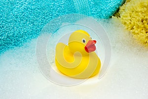 Yellow rubber duck with bath foam