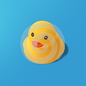 Yellow rubber duck on blue background Modern style. creative photography