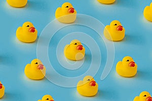 Yellow rubber duck pattern, against blue background. creative pattern