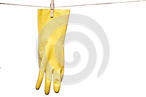 A yellow rubber glove on a clothesline