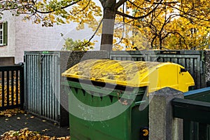 Yellow rubbish container