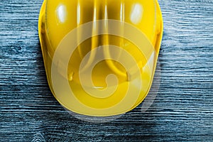 Yellow safety cap on wooden board