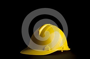 Yellow safety Engineer and Architect helmet on black background