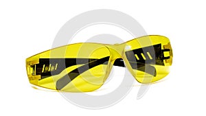 Yellow safety glasses close up, isolated