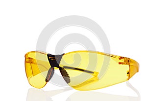 Yellow safety glasses isolated on white.