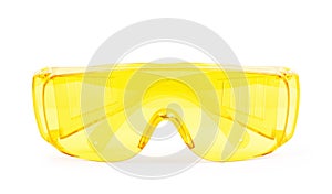 Yellow safety glasses on white background photo
