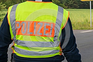 Yellow safety vest with the inscription police