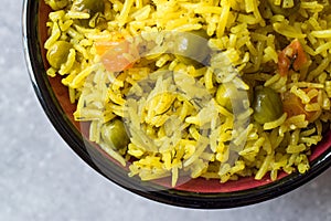 Yellow Saffron Basmati Rice with Turmeric and Vegetables Pilav or Pilaf in Bowl.