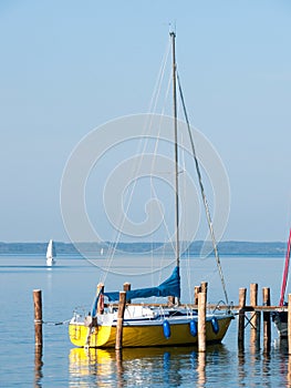 Yellow Sailboat on an Alpine lake