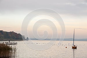 Yellow Sailboat at Sunset