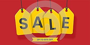 Yellow sales tags banner on red background