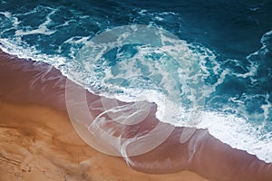Yellow sand beach and azure foam wave, shot from above, nature o