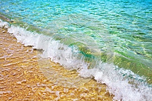 Yellow sand beach, blue sea wave and white foam landscape, turquoise transparent ocean water splash, summer holidays concept