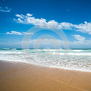 Yellow sand beach, sea and deep blue sky