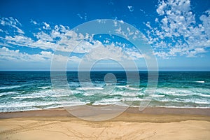 Yellow sand beach, sea and deep blue sky