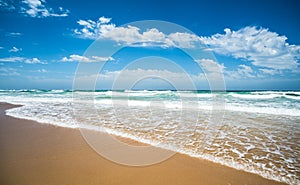 Yellow sand beach, sea and deep blue sky