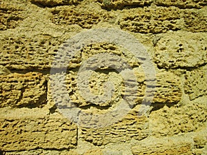 Yellow sand tuff, old tuff bricks, tuff wall.