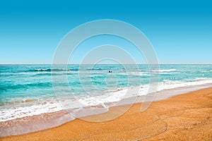 Yellow sand and turquoise color waters at swimming area of sea with lots of people learning how to surf - Jeju Island, South Korea