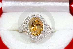 Yellow sapphire ring on white