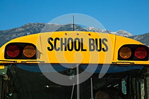 Yellow school bus blue sky closeup