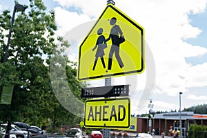 Yellow school zone crossing sign