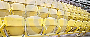 Yellow seats in the stands before the sporting event