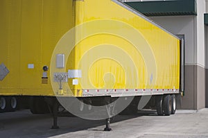 Yellow Semi Trailer at warehouse