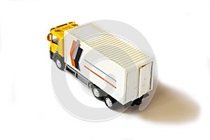 A yellow semi truck with a white trailer attached. Isolated on a white background. Clipping path included
