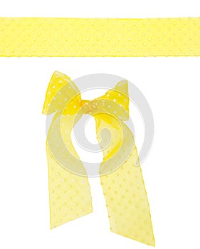 Yellow semitransparent dotted ribbon with a bow