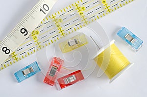 Yellow Sewing Kit with Ruler on White Background