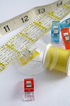 Yellow Sewing Kit with Ruler on White Background